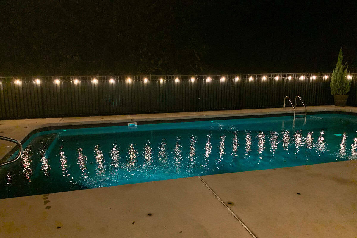 pool lit up at night