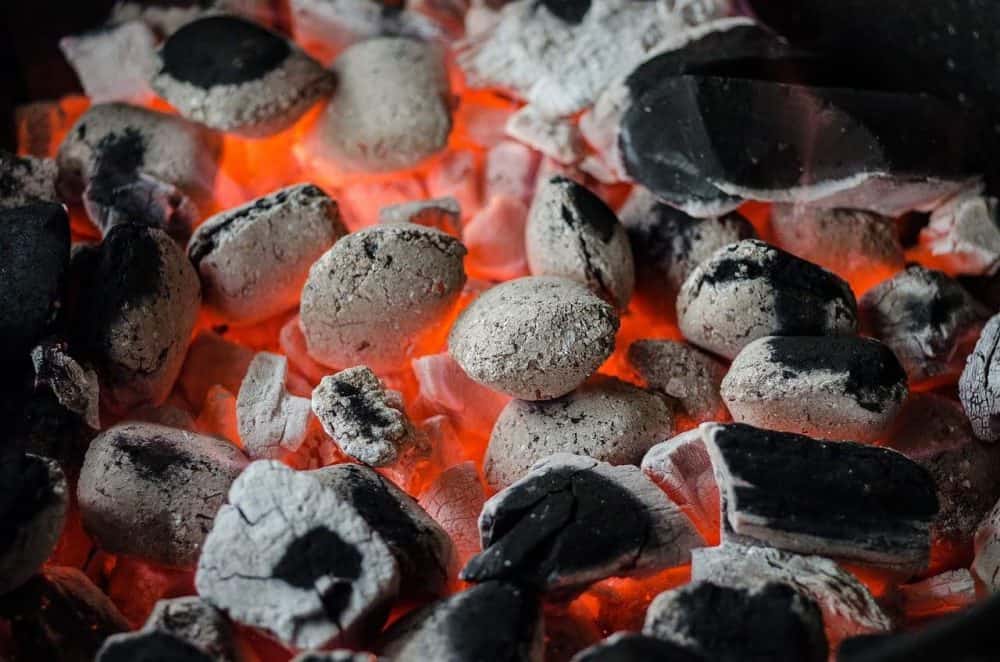 coals lit in a oklahoma joe smoker