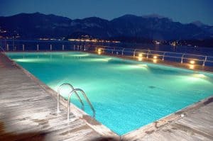 a pool with its lights on at night