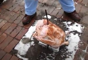 putting the trash can turkey on the bricks and rebar