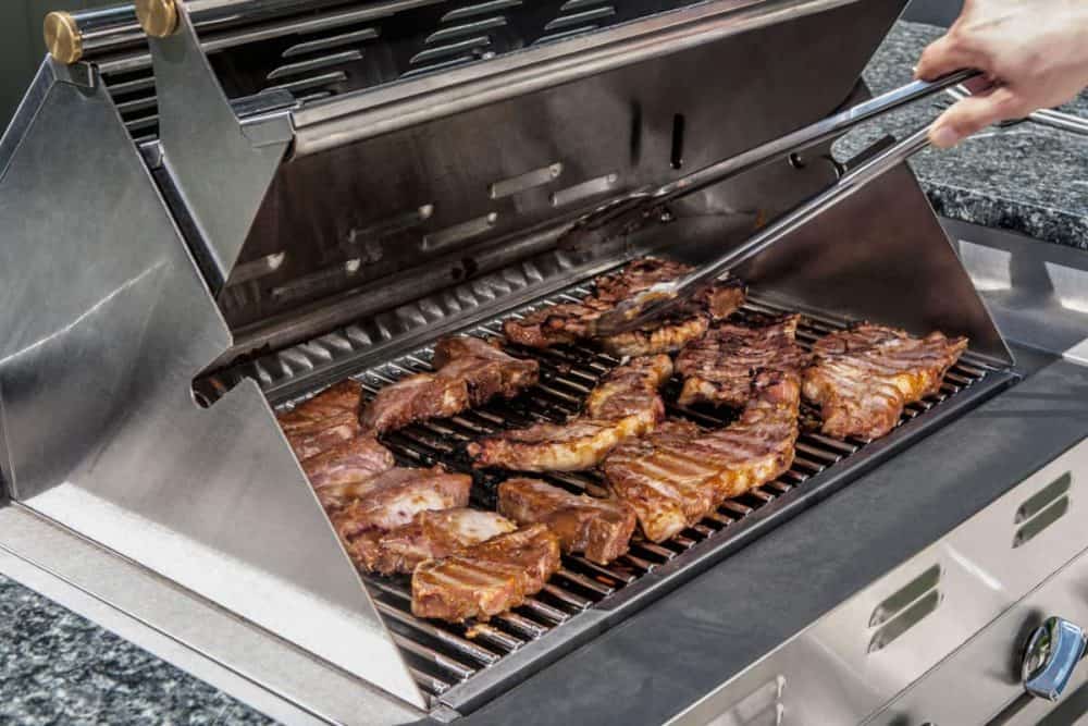 An Infrared grill cooking steaks