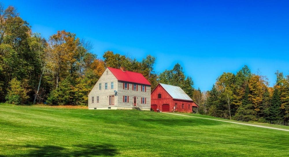a northeastern home a grassy lawn