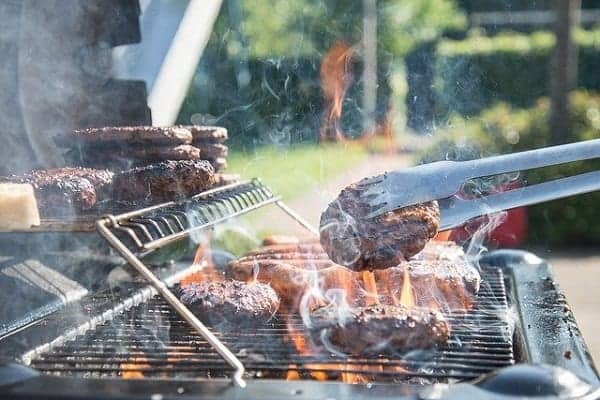 food being cooked on a weber genesis grill