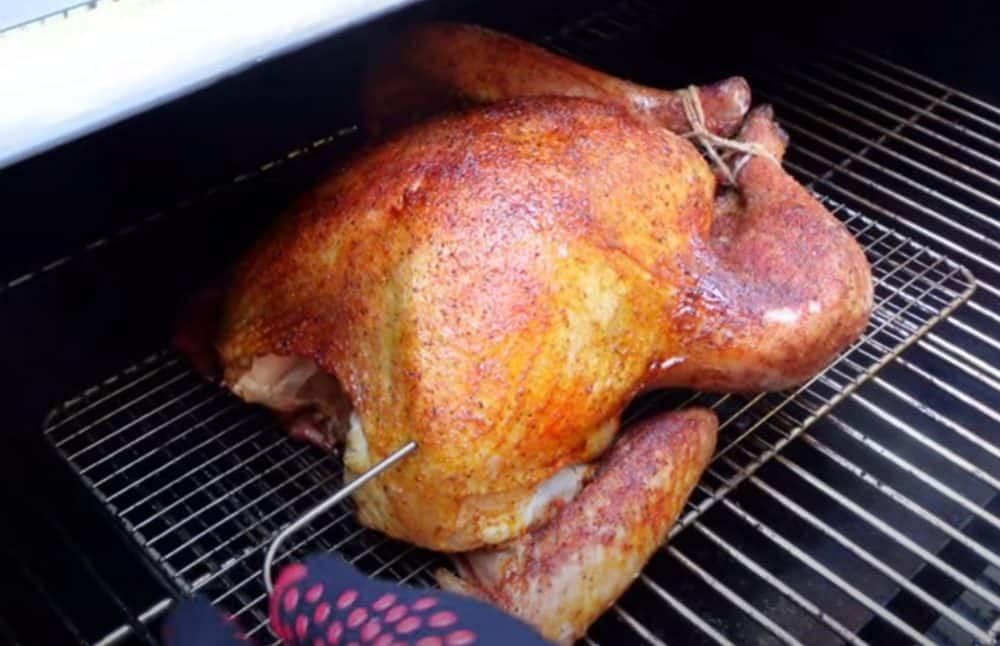 a smoked turkey cooking on a pellet grill