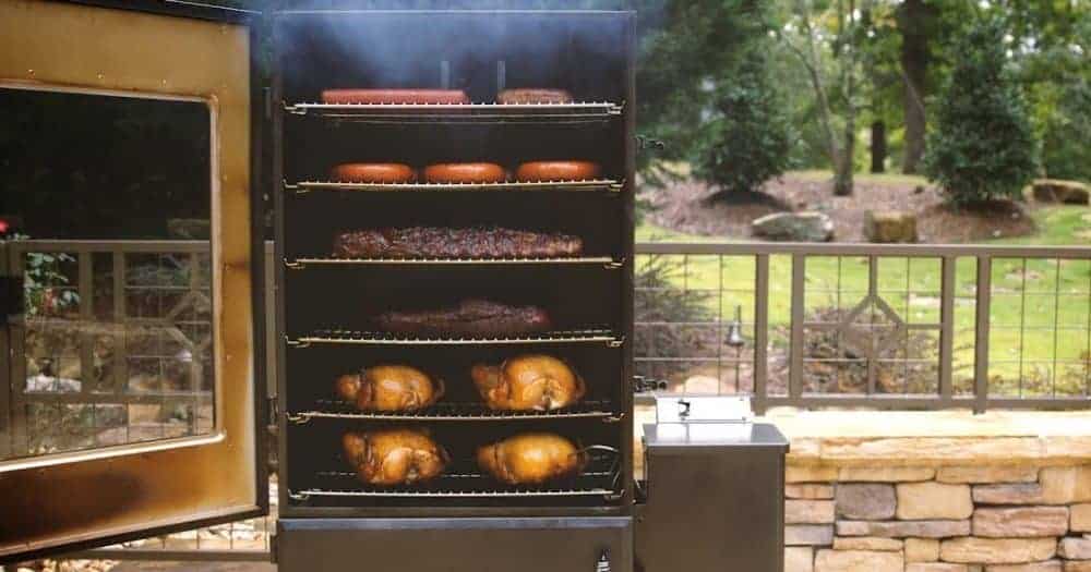 a vertical smoker full of food