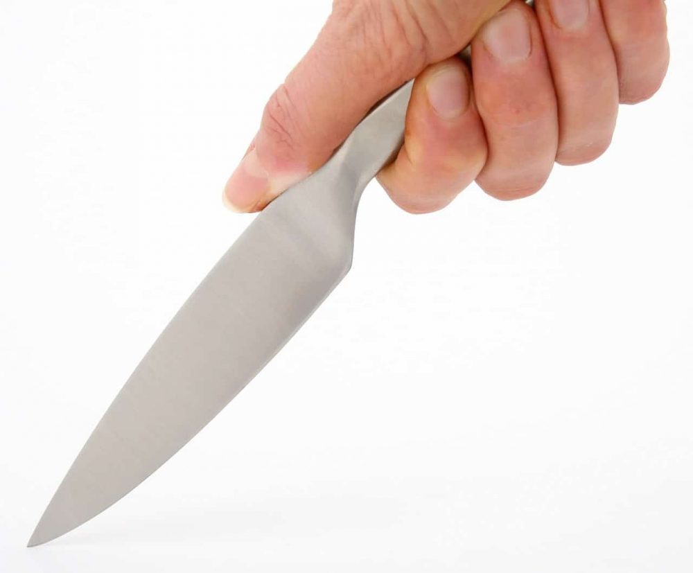 holding a meat cutting knife handle