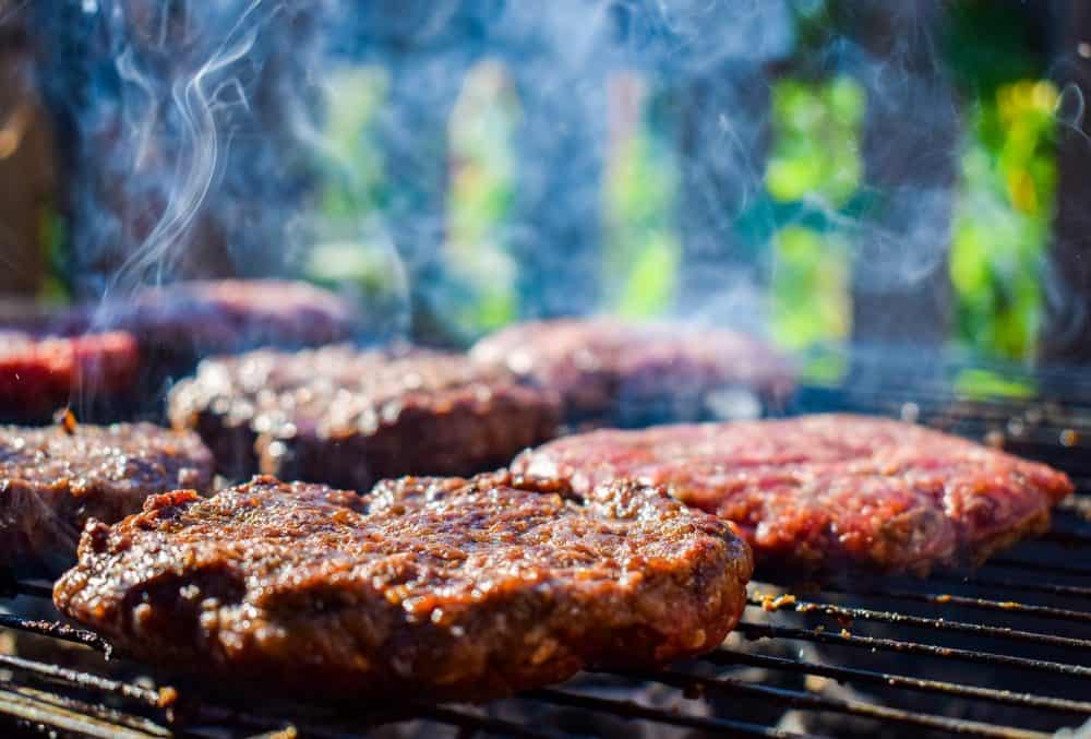 hamburgers flipped too soon on a gas grill