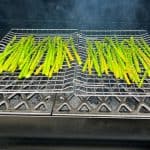 smoked asparagus smoking on a grill