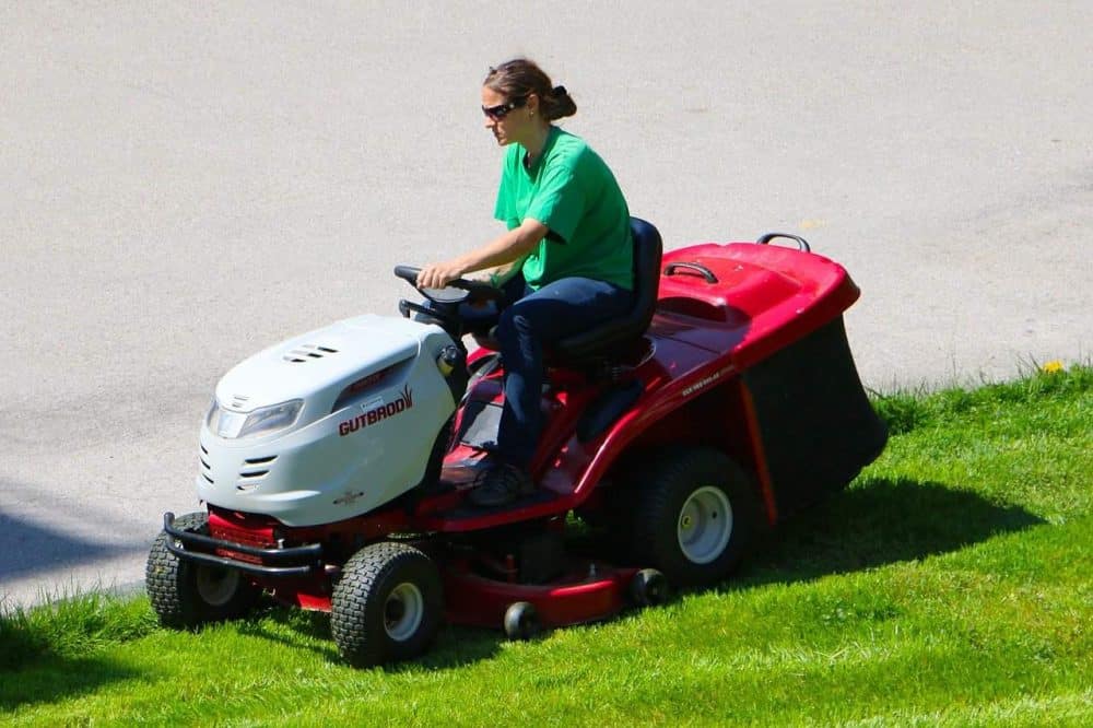 riding a fast lawn mower