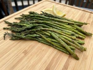 smoked asparagus on a cutting board