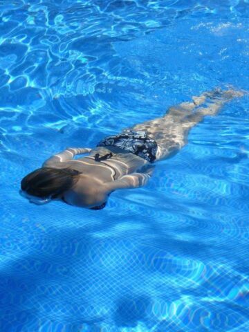 woman swimming in well chlorinated pool