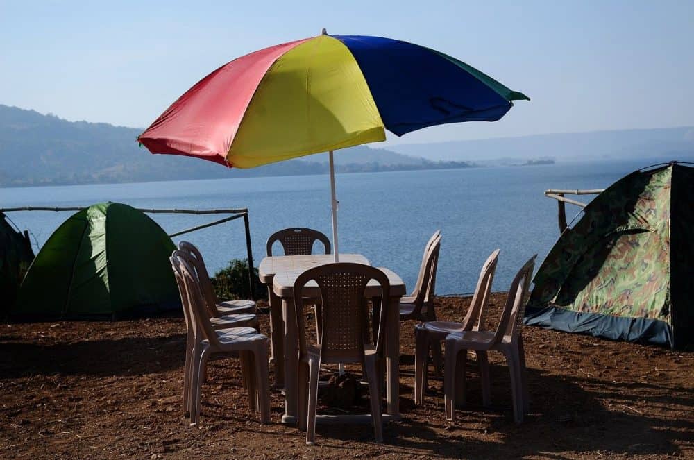 a patio umbrella with a base so that it does not fall over