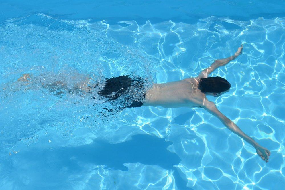 a man swimming in a pool