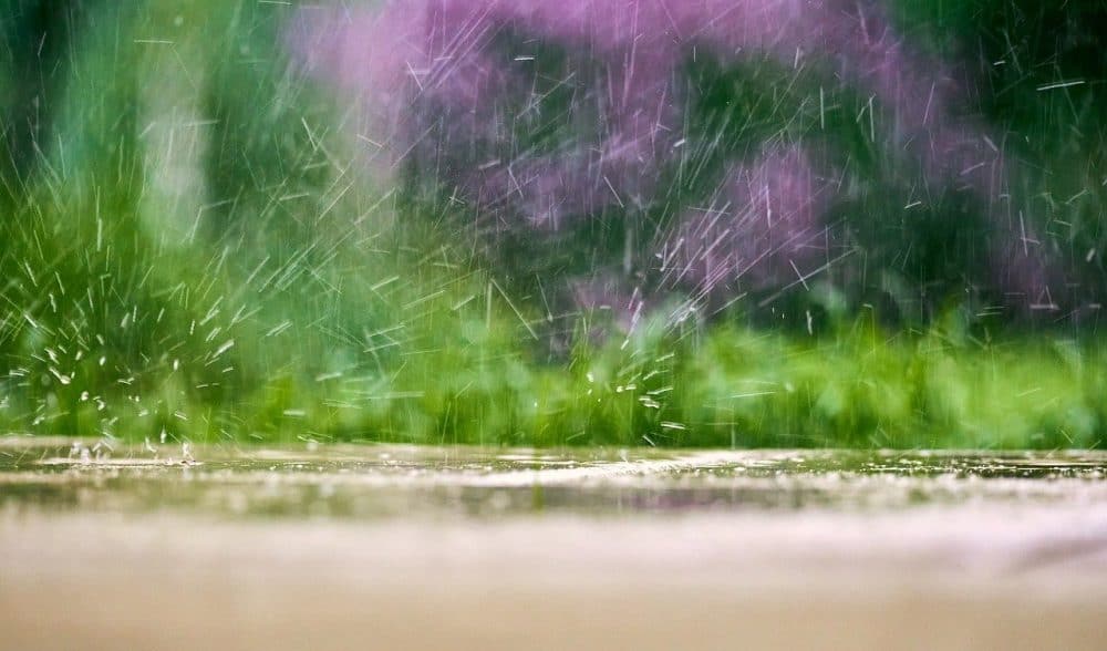 rain accumulating on a patio not sloped for drainage