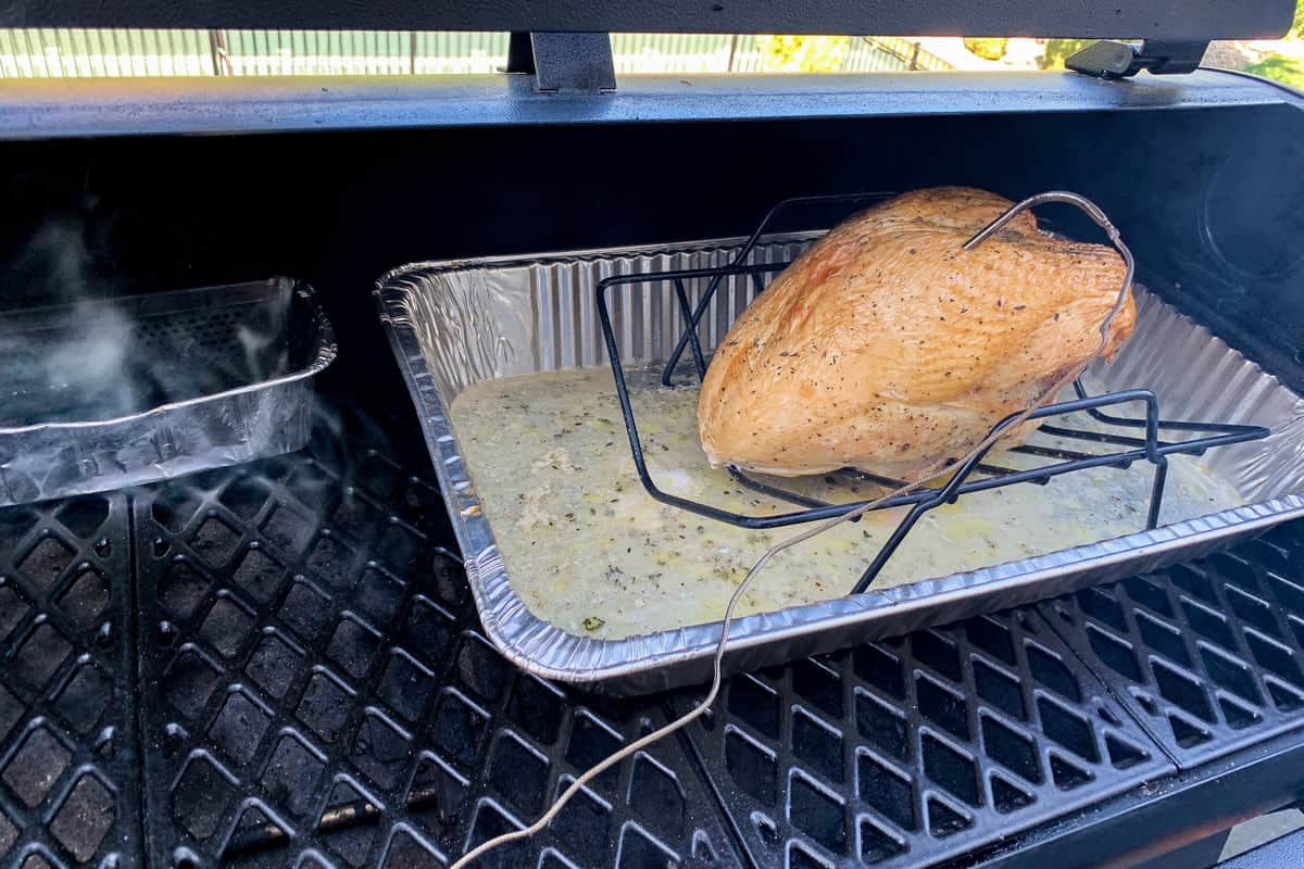 turkey breast cooking in a pellet grill