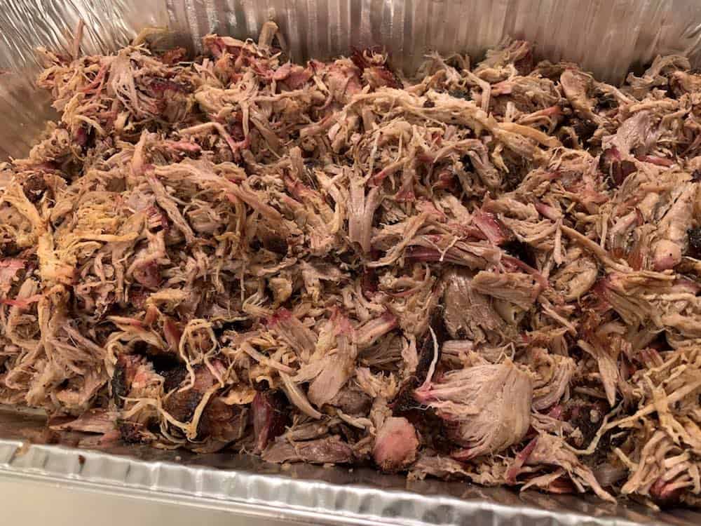 a tray of shredded smoked pulled pork