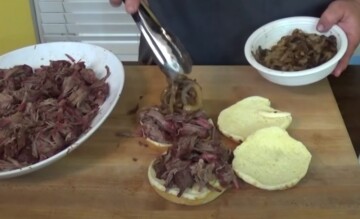 assembling pulled beef sandwiches from smoked chuck roast out of electric smoker
