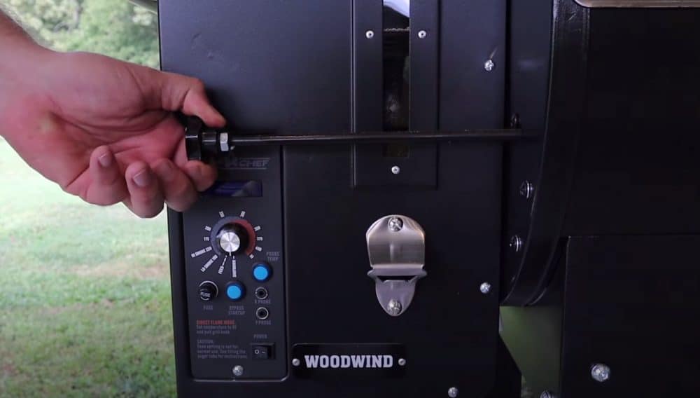 pulling the knob out on a camp chef pellet grill for direct heat