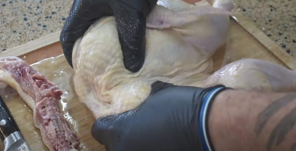 snapping the breastbone of a spatchcocked chicken