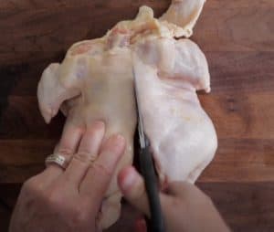 cutting and spatchcocking chicken to smoke on a pellet grill
