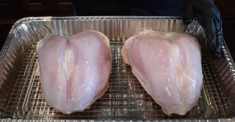 turkey breasts sitting in an aluminum pan