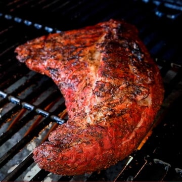 smoked tri tip roast on the grates of a pit boss pellet grill