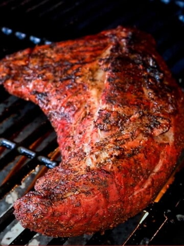 smoked tri tip roast on the grates of a pit boss pellet grill