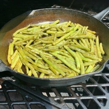 smoked green beans in a cast iron skillet