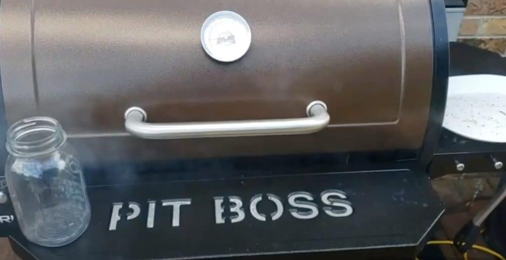 a pit boss pellet grill making smoke and cooking