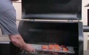 putting salmon on the smoker
