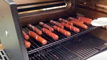 smoked hot dogs on a smoker