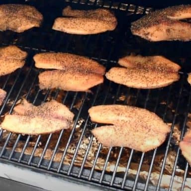 smoked tilapia on a traeger smoker pellet grill