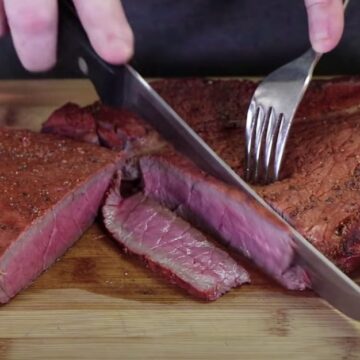 slicing a smoked london broil