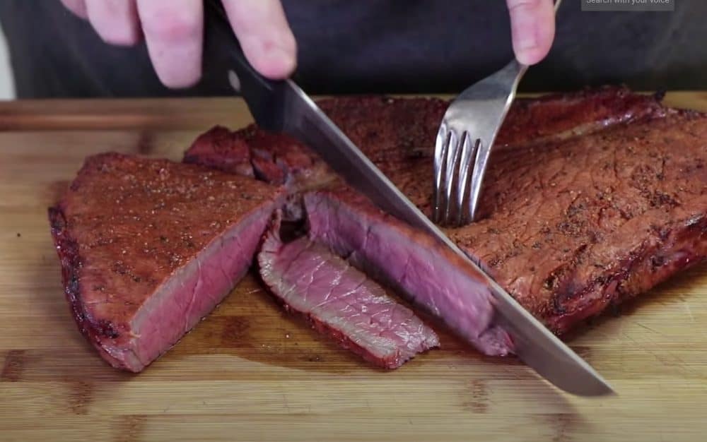slicing a smoked london broil