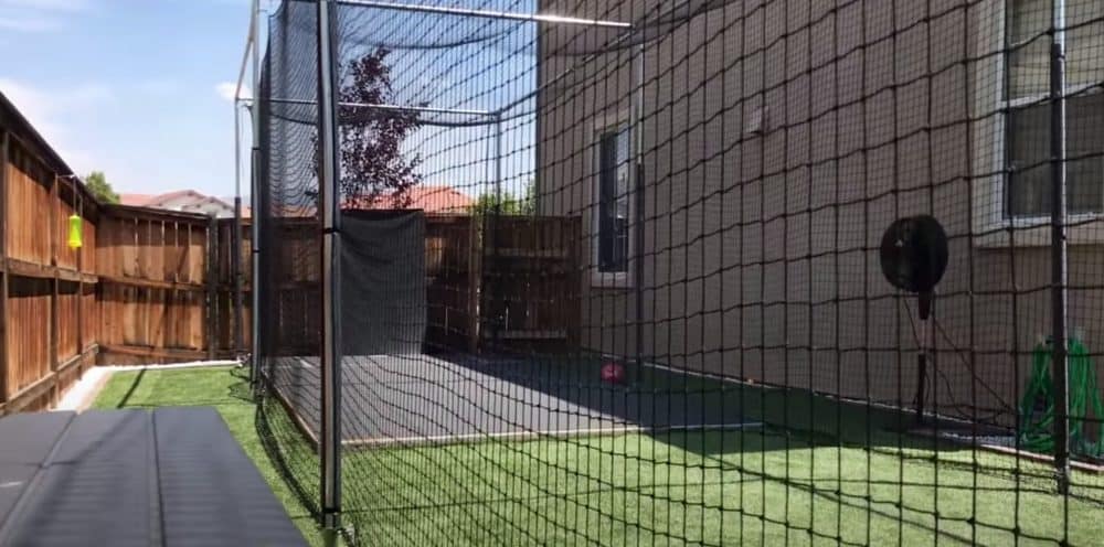 A finished DIY backyard batting cage