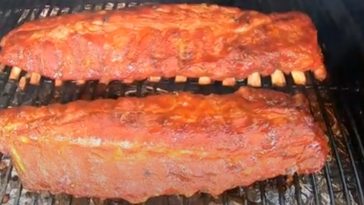 baby back ribs smoking on a pellet grill