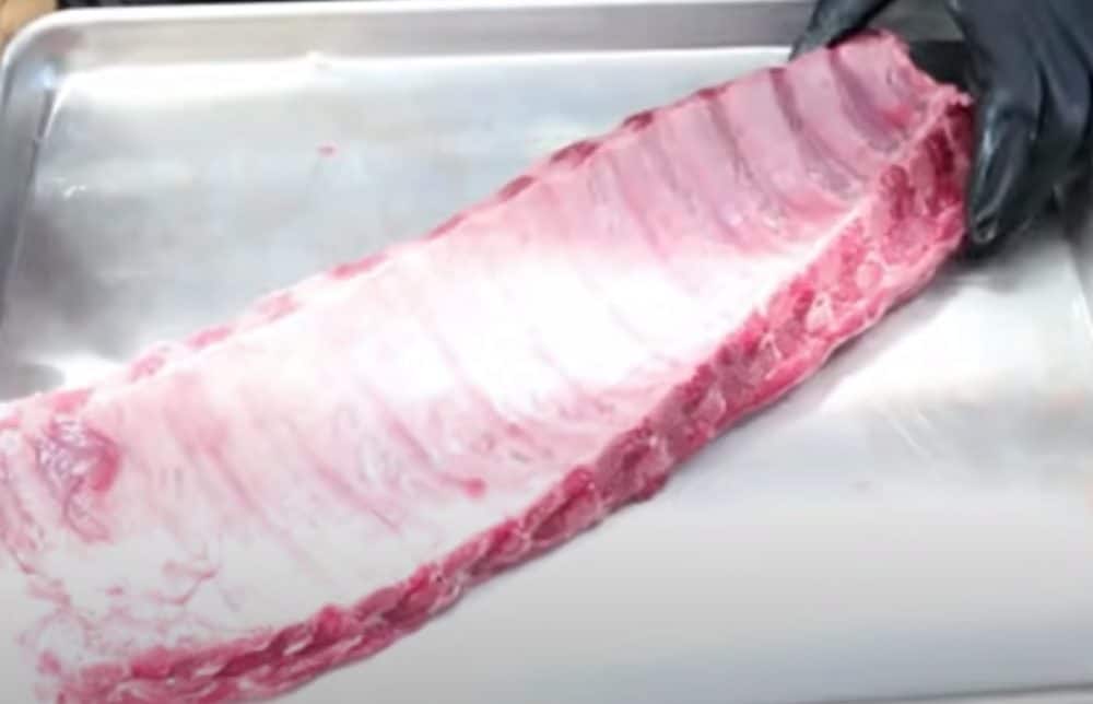 the thick membrane on the back of a slab of baby back ribs before it is removed