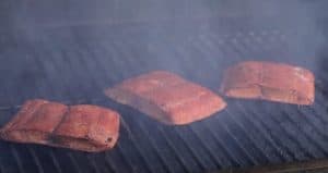 smoked mahi mahi cooking in a smoker