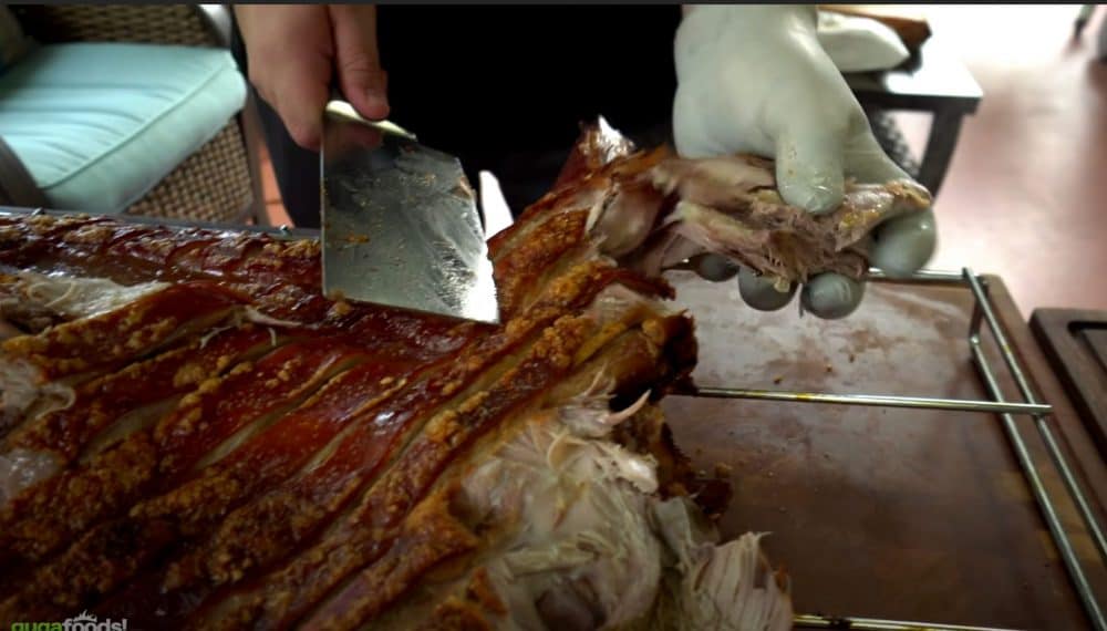 carving a roast pig