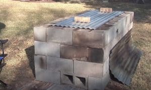 cinder block oven for roasting a pig in a backyard