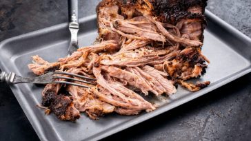 finished traeger smoked pulled pork on a platter