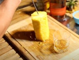 injecting bourbon into a pineapple before smoking