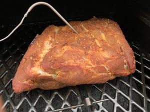 a pork butt smoking on a pit boss pellet grill