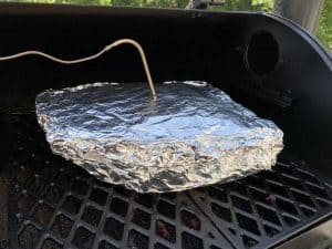 a wrapped pork butt on a pit boss pellet grill