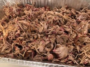 a tray of pit boss smoked pulled pork