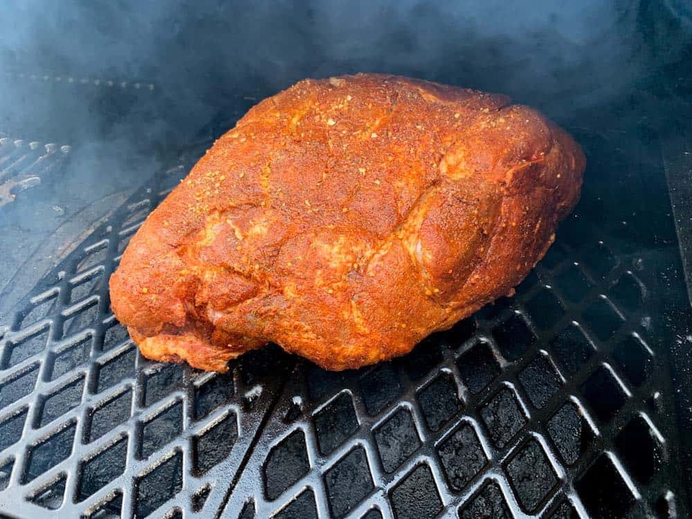 a pork butt cooking in a pit boss pellet grill