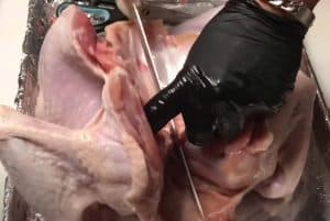 cutting the breastbone of a spatchcock turkey