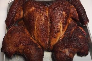 a spatchcock turkey smoked on a pellet grill