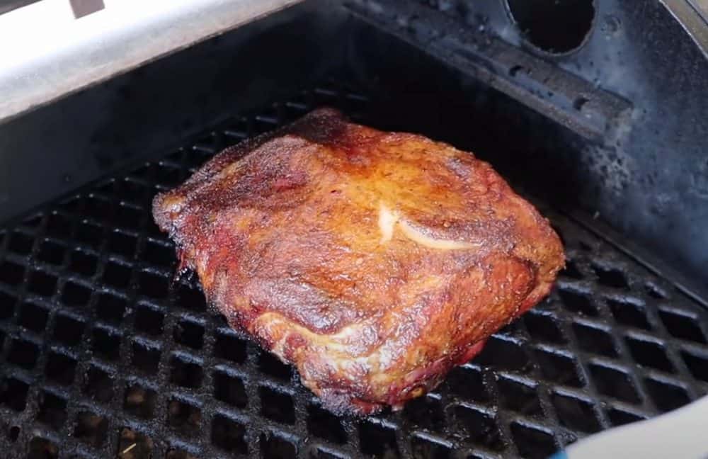 a boston butt smoking on a pit boss