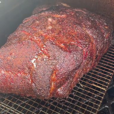 pork shoulder smoking on a pit boss pellet grill